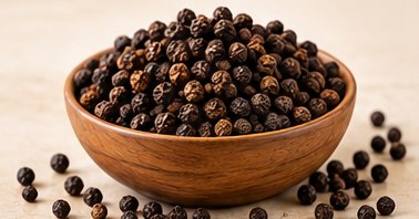Black Pepper in a bowl, illustrative agricultural commodity photograph
